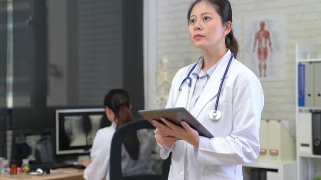 Asian Woman Doctor Thinking