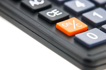 Orange open and close button on black calculator