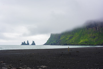 Fototapeta na wymiar Basalt rock formations or Troll toes. Reynisdrangar, Vik, Iceland