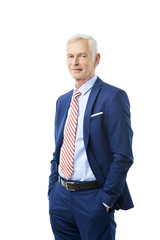 Successful senior lawyer. Portrait of  happy senior businessman standing with arms crossed while looking at camera and smiling. Isolated white background.