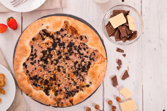 Sweet chocolate pizza with cookies. 