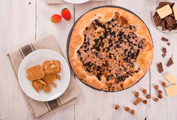 Sweet chocolate pizza with cookies. 