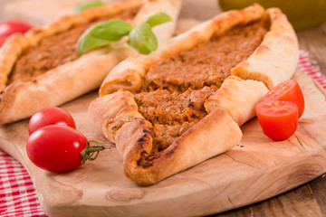 Turkish pide pizza with meat and onion. 