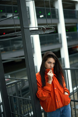 Fototapeta premium Portrait of young beautiful fashionable woman hippy in red jacket in the summer near the summer house