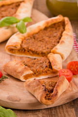 Turkish pide pizza with meat and onion. 