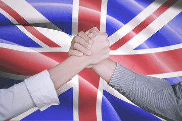 Hands of business people with England flag