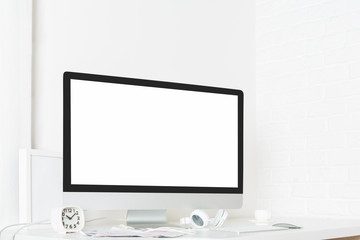 Stylish desk with empty laptop screen