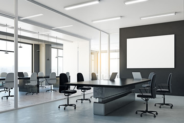 Meeting room with blank poster