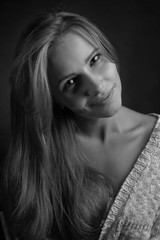 Naklejka premium Young attractive woman with long curly hair .