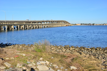 Fototapeta na wymiar Bridge crossing from Pensacola beach to Gulf breezes