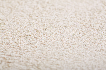 fabric and texture concept - close up of a towel terry cloth or terry textile background