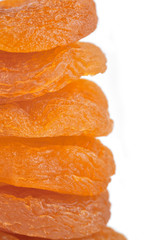 Dried apricot ingredient close up isolated on a white background. One orange apricot fruit with clipping path photo for advertising