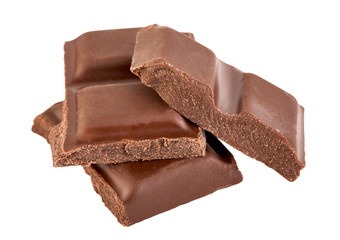 Milk chocolate pieces isolated on white background.