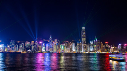 Hong Kong, China. August 30, 2017.  Skyline at night with lights and skyscrapers over sea with...
