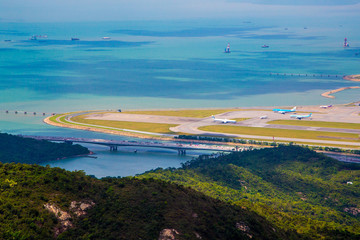 Aerial view of the Lantau Island in Hong Kong with nature, new bridge and the ocean 