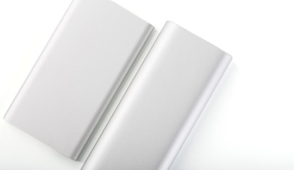 Power bank for charging mobile devices. White smart phone charger with power bank. battery bank. External battery for mobile devices.