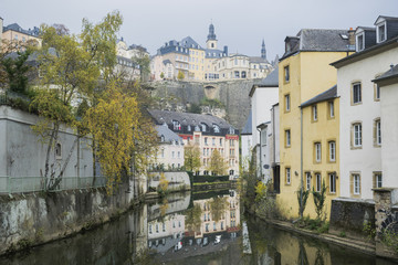 Fototapeta na wymiar Detail of famous Luxembourg city line in November with Saint Michael Cathedral and water reflections, Luxembourg.