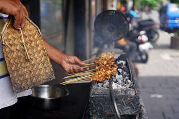 Satay or in Indonesian called sate is a dish of seasoned, skewered and grilled meat, served with a...