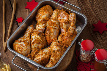 Marinated chicken drumsticks ready for baking.