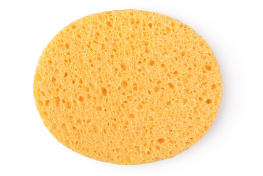 Oval Yellow Sponge Cleansing Puff For Face Or Cleaning Surface Texture Isolated On White Background On Top View