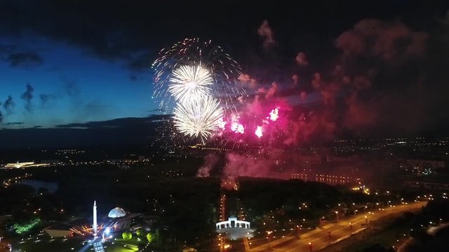 Top view of the festive fireworks and night fireworks over the city, colorful lights, a festive celebration.