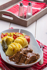 Roast turkey in gravy.