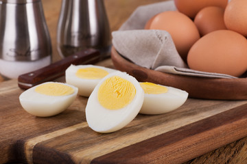 Sliced Hard Boiled Eggs on a Wooden Cutting Board