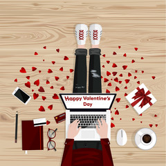 Happy Valentine's Day. Freelancer graphic designer sitting on a wooden floor and typing on laptop. Flat style vector illustration. Freelance concept.