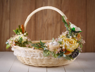 Fototapeta na wymiar Wicker Designer Basket decorated with flower