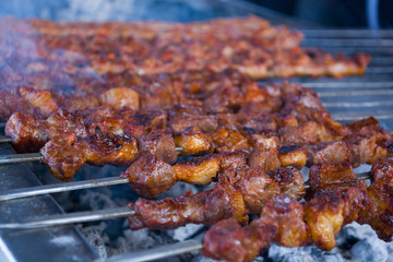 grilled kebab cooking on metal skewer closeup roasted meat cooked at barbecue bbq fresh beef meat