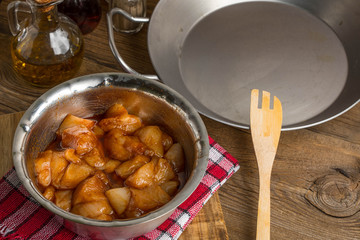 Chunks of chicken in marinade.