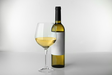 Wine bottle mock up and glass on white background