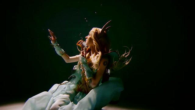 mysterious elf girl with long white hair underwater in armour and war dress