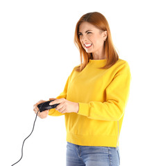 Emotional woman with video game controller on white background