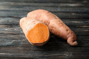 Sweet potatoes on wooden table