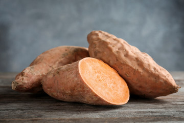 Sweet potatoes on wooden table