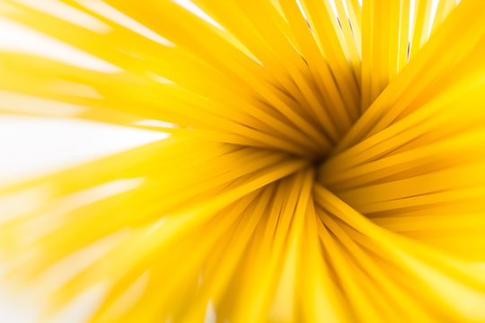 Yellow pasta on white isolated background close up mackro.