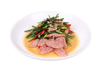 Isolated of Fried Chinese chives with Thai sour sausage .