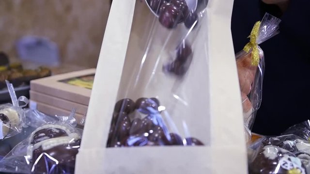 Put candy in a transparent package. HD, 1920x1080, slow motion