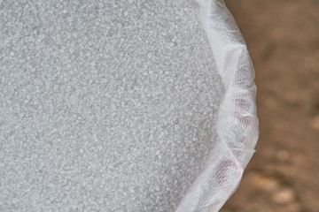 21-0-0, Ammonium sulfate, (NH4) 2SO4,  Mohrs Salt. Fertilizer in white fertilizer bag.