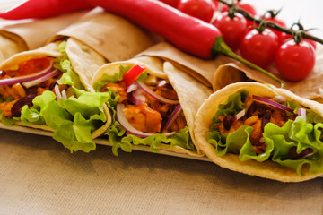 Mexican burrito with chicken, pepper and beans