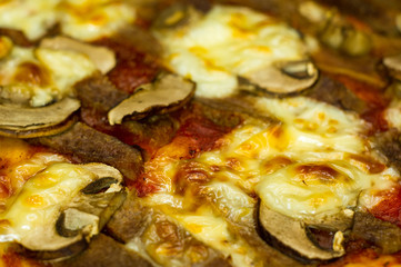 pizza with cheese, mushrooms and meat