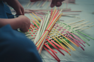 Thai students grade 4 in primary school are weaving pattern thai.