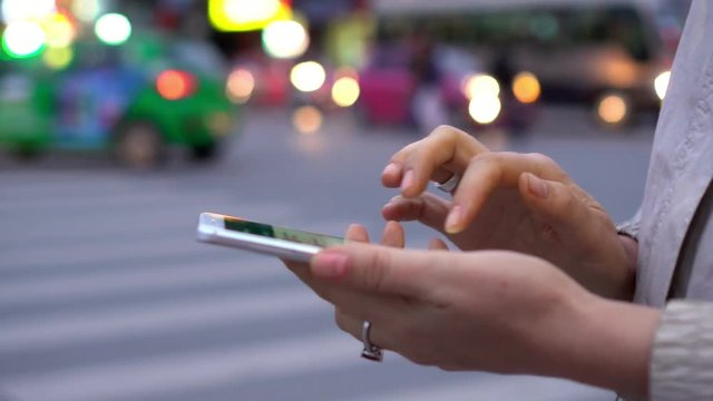 Close-Up Woman Using Smart-Phone In The City