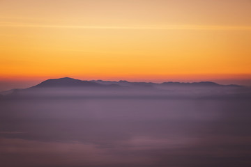 Fototapeta premium sunrise with fog on the Mountain in the morning