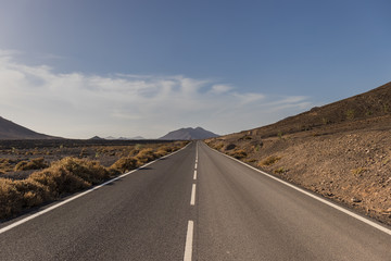 Empty Road with mountain in the horizon, Fuerteventura, Canary Islands
