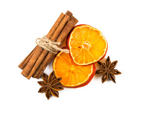 Cinnamon sticks tied with string, slices of dried orange and star anise