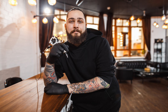 Portrait of professional creative tattoo master