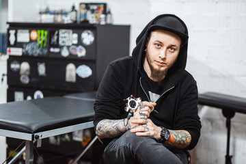 Portrait of professional creative tattoo master