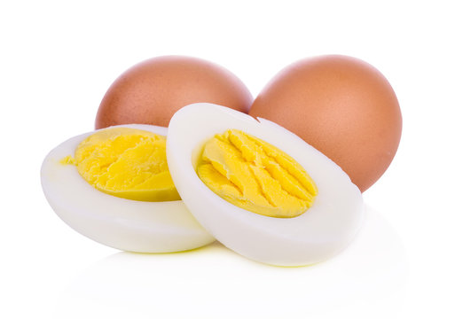 two halves of a boiled egg on white background